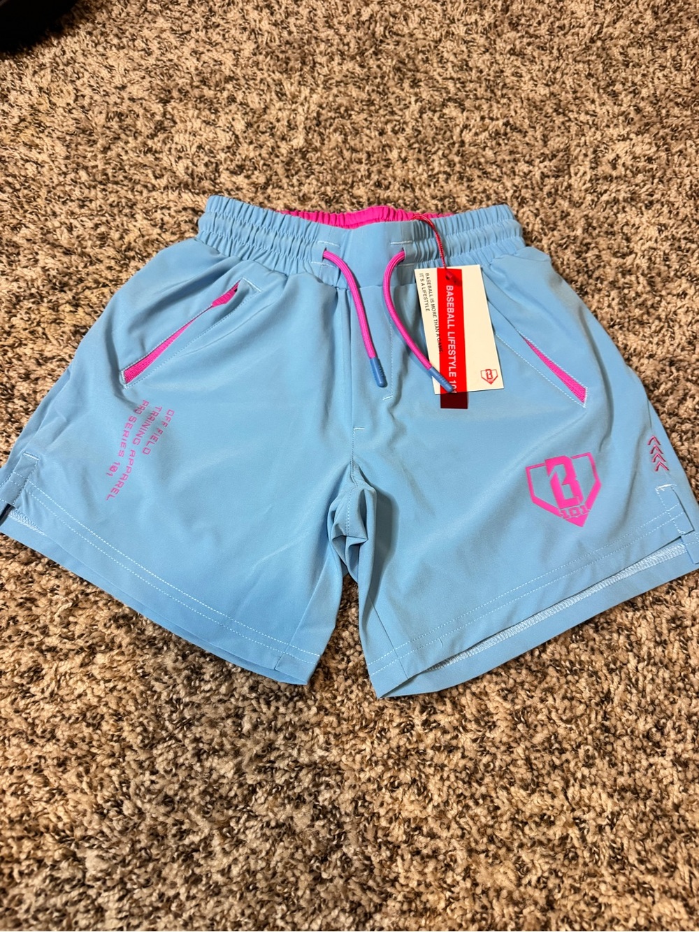 Light Blue Kid’s YS BASEBALL-LIFESTYLE 101 Athletic Shorts with Pink Accents
